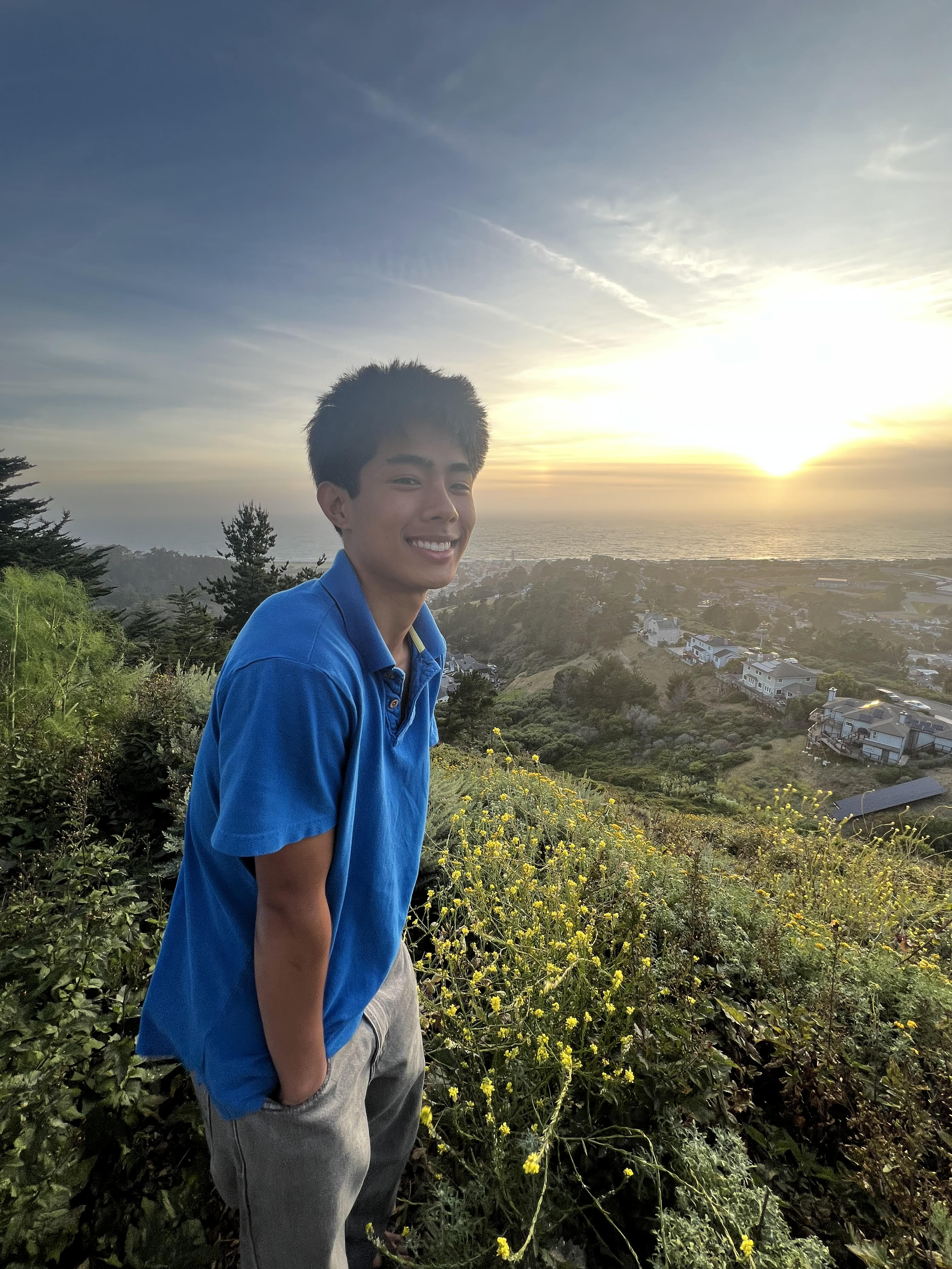 Braedon at the beach at sunset